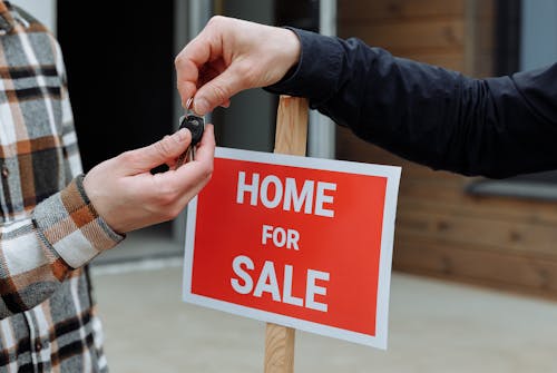 a-person-handing-out-the-keys