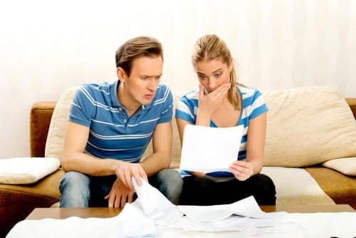 adult-couple-sitting-sofa