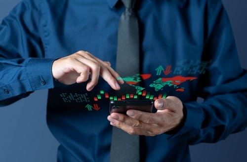 businessman-checks-candlestick-chart