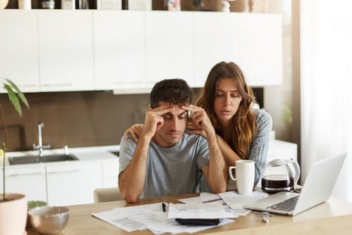 couple-checking-their-family-budget couple-checking-their-family-budget